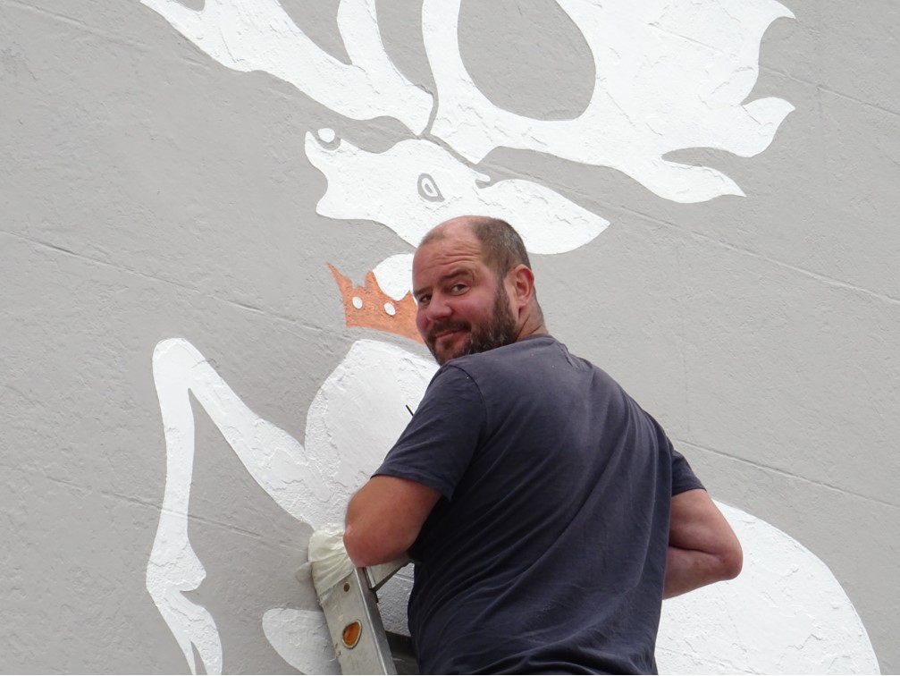 Louis Hodge puts the finishing touches to the mural in Tavistock’s Brook Street.